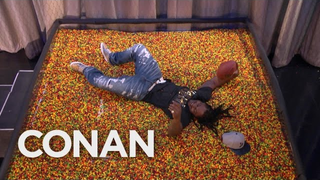 Marshawn Lynch Dives Into "End Zone" Full Of Skittles On <i>Conan</i>